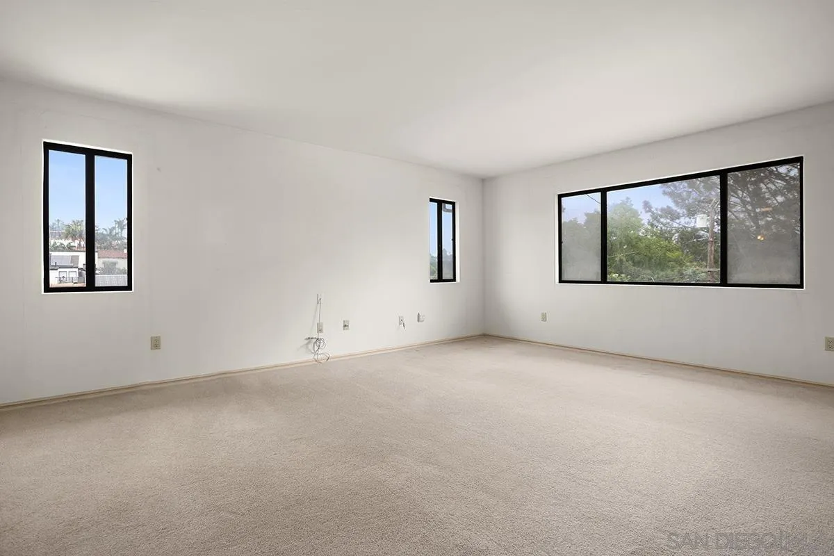 3130 Goldfinch Street San Diego, CA 92103 - Photo 29 of 59 an empty room with windows