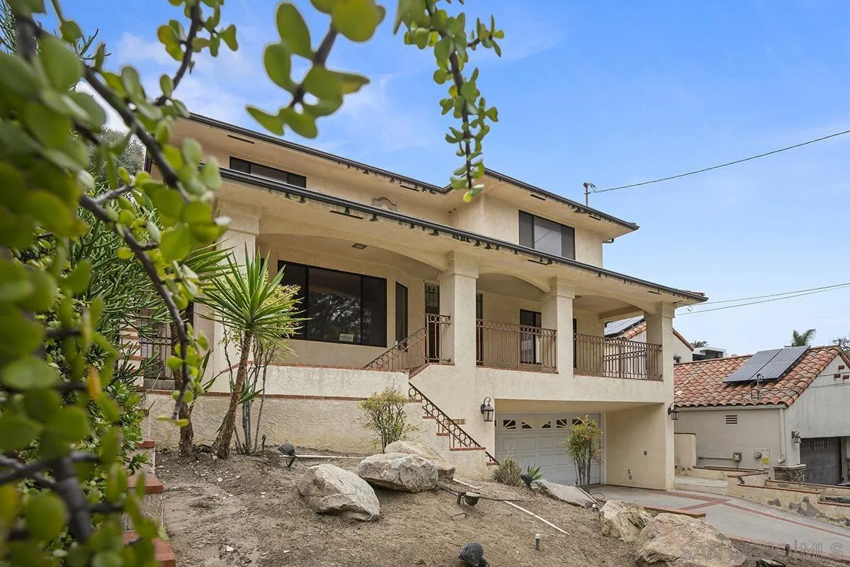 3130 Goldfinch Street San Diego, CA 92103 - Photo 4 of 59 a front view of a house with a tree