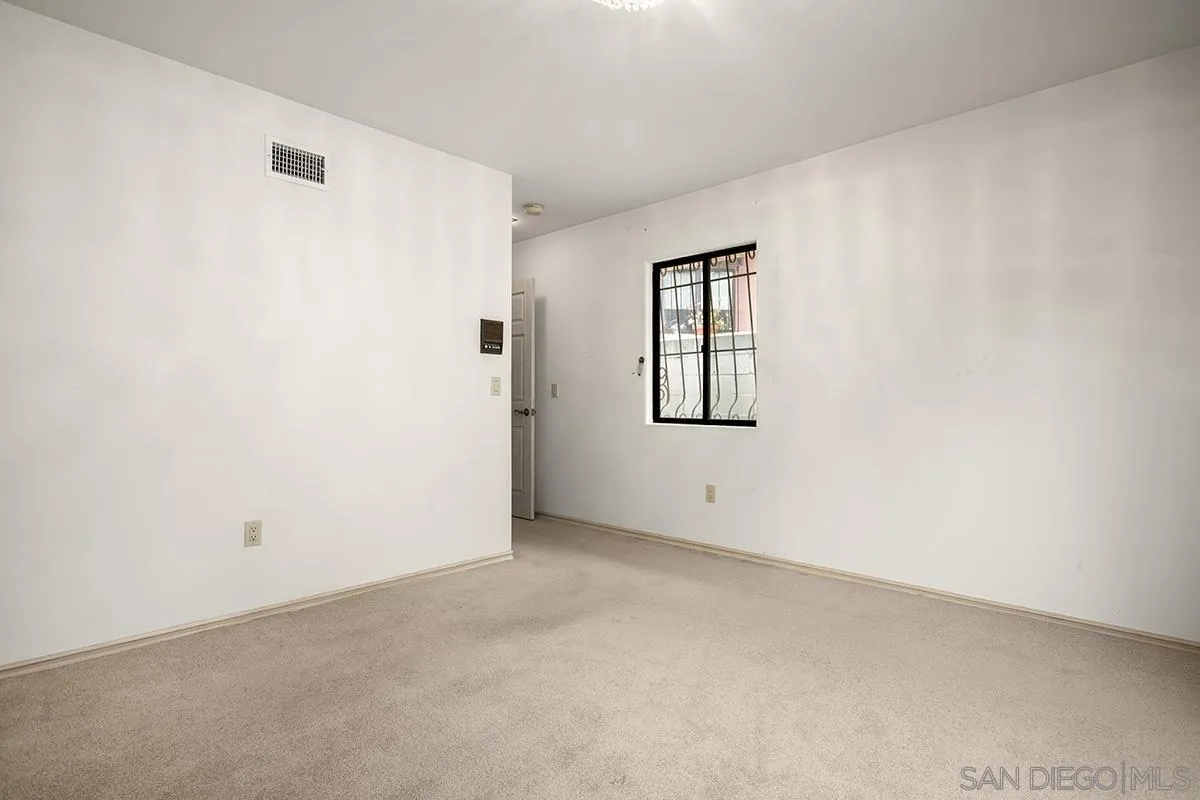 3130 Goldfinch Street San Diego, CA 92103 - Photo 42 of 59 an empty room with windows