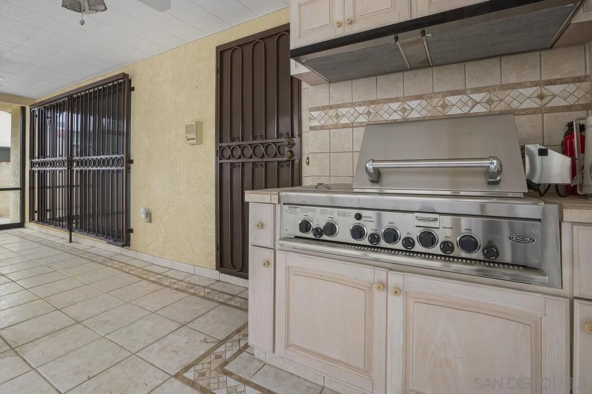 3130 Goldfinch Street San Diego, CA 92103 - Photo 47 of 59 a kitchen with stainless steel appliances a stove and cabinets