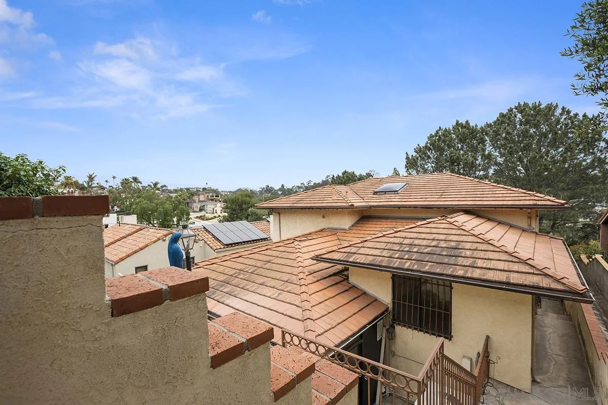 3130 Goldfinch Street San Diego, CA 92103 - Photo 53 of 59 a view of a patio with table and chairs with wooden floor and fence