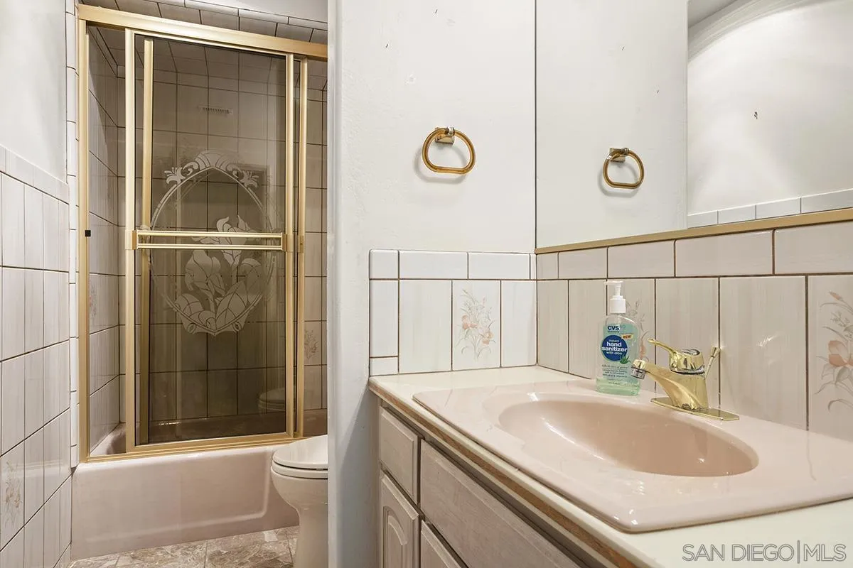 3130 Goldfinch Street San Diego, CA 92103 - Photo 54 of 59 a bathroom with a sink a toilet and shower