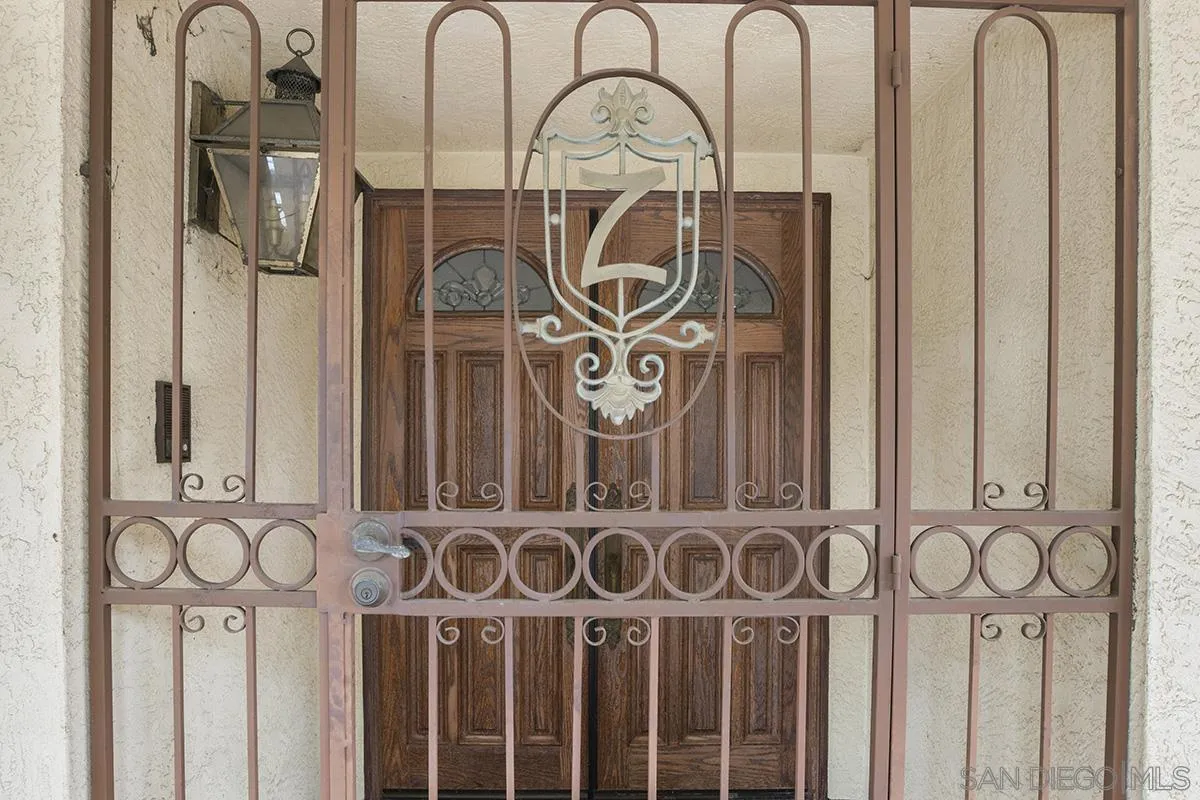 3130 Goldfinch Street San Diego, CA 92103 - Photo 6 of 59 a front view of a door with wooden fence
