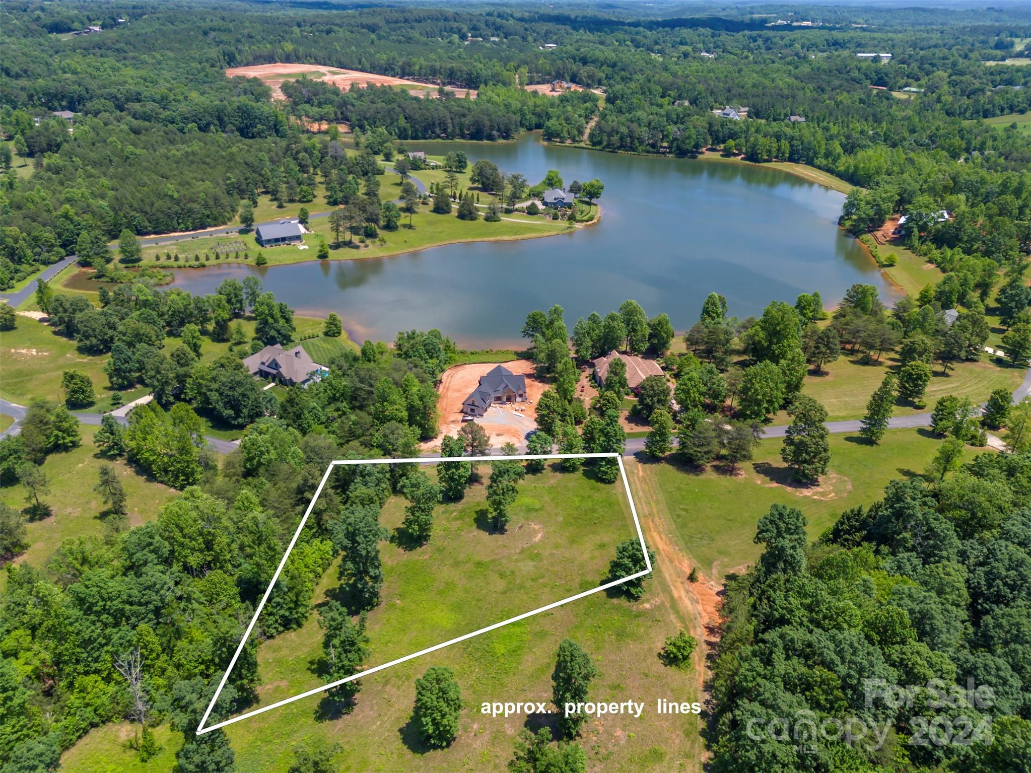 Lot 36 Mapleton Lane Columbus, NC 28722 - Photo 1 of 17 an aerial view of a house with a lake view