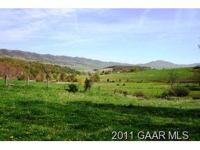 3315 Maple Sugar Road Monterey, VA 24465 - Photo 8 of 17 a view of a lush green hillside and houses