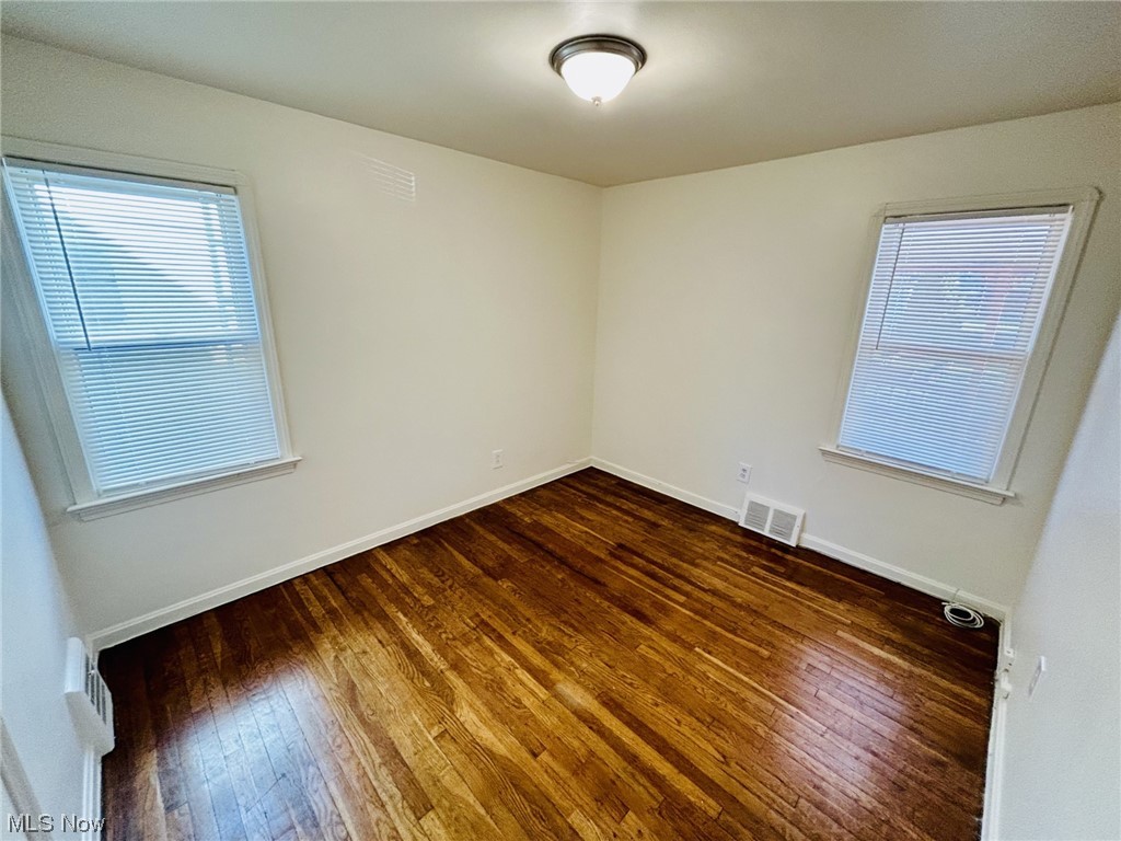 13414 Rockside Road Garfield Heights, OH 44125 - Photo 11 of 25 Empty room featuring dark hardwood / wood-style floors