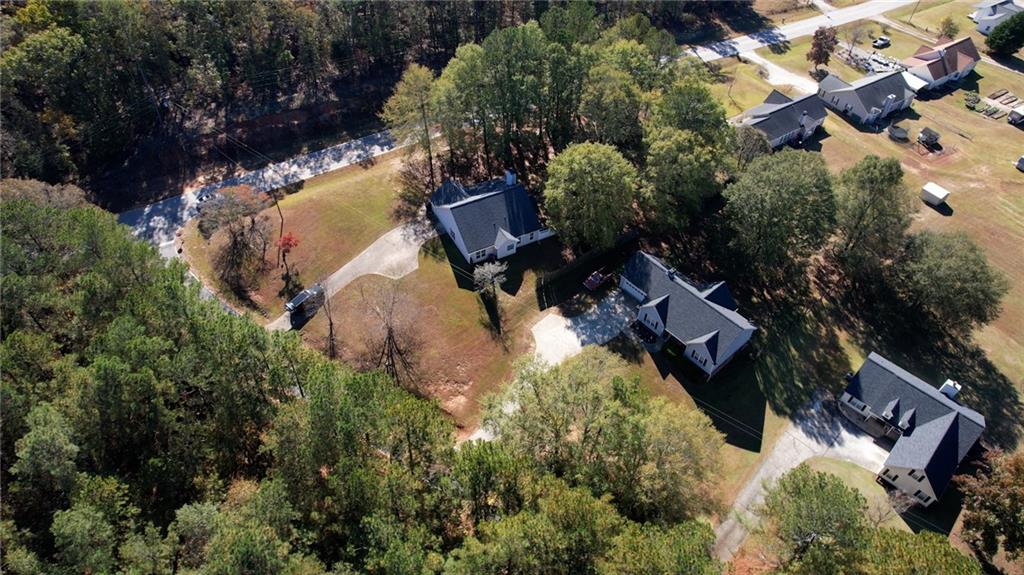 55 Ashland Farm Road Oxford, GA 30054 - Photo 12 of 55 an aerial view of a house with a yard and lake view
