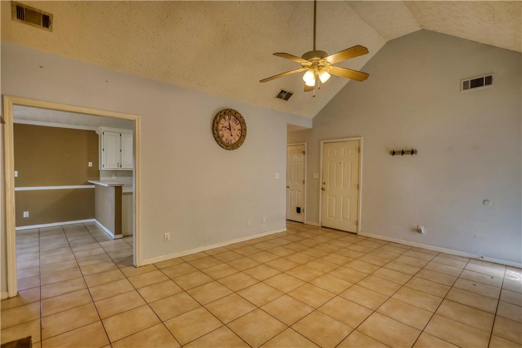 55 Ashland Farm Road Oxford, GA 30054 - Photo 18 of 55 a view of a livingroom with a chandelier fan and kitchen view
