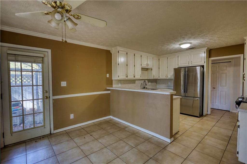 55 Ashland Farm Road Oxford, GA 30054 - Photo 28 of 55 a kitchen with stainless steel appliances granite countertop a refrigerator and a sink