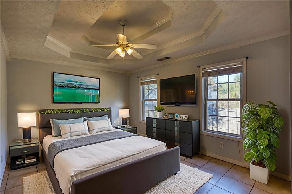 55 Ashland Farm Road Oxford, GA 30054 - Photo 29 of 55 a bedroom with a bed and a flat screen tv