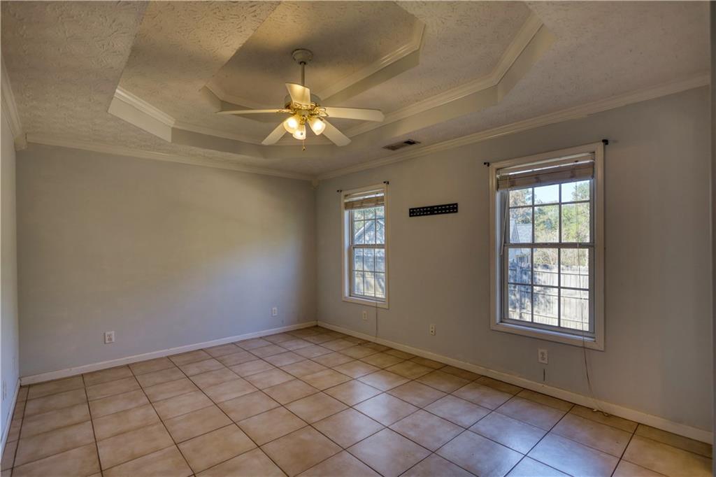 55 Ashland Farm Road Oxford, GA 30054 - Photo 30 of 55 en empty room with windows and ceiling fan