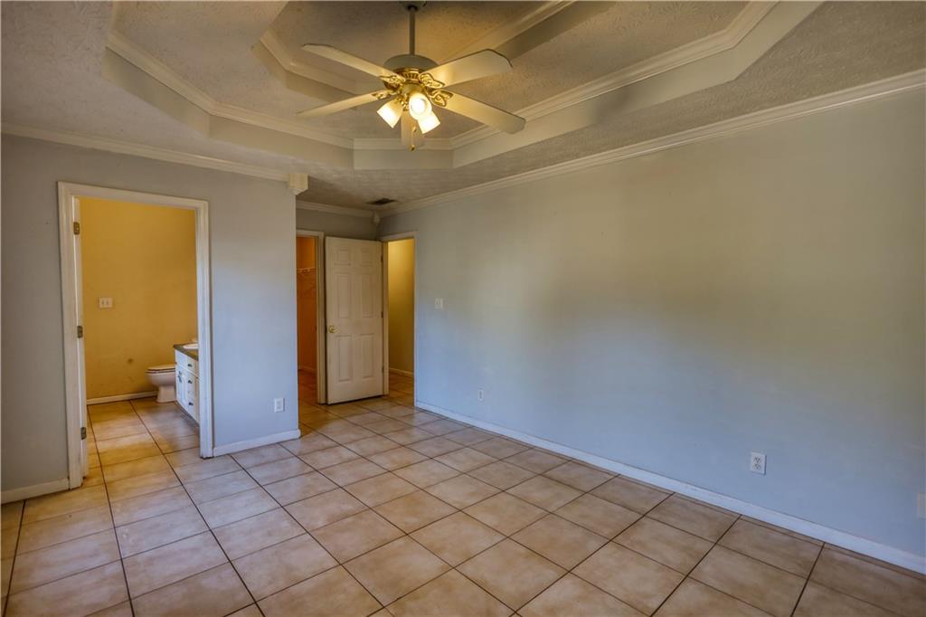 55 Ashland Farm Road Oxford, GA 30054 - Photo 32 of 55 an empty room with a ceiling fan and bathroom