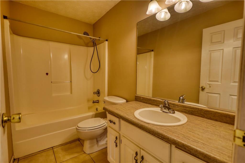 55 Ashland Farm Road Oxford, GA 30054 - Photo 37 of 55 a bathroom with a granite countertop sink toilet and shower