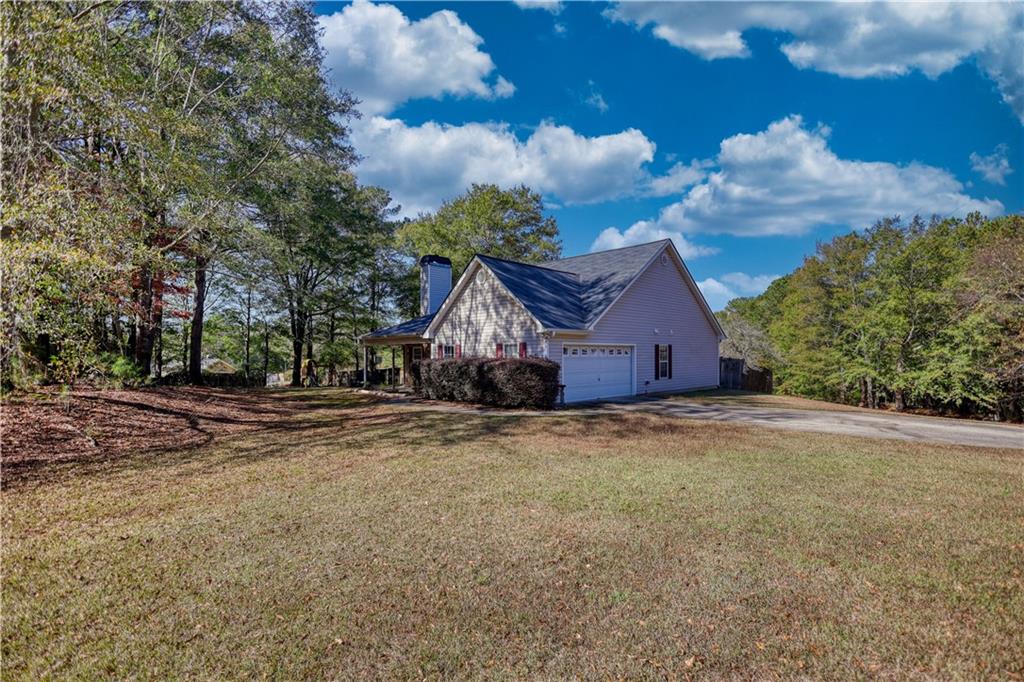 55 Ashland Farm Road Oxford, GA 30054 - Photo 50 of 55 a view of a house with a big yard and large trees