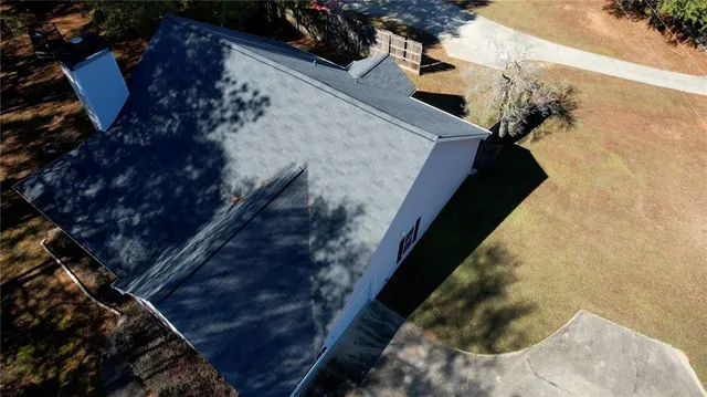 an aerial view of a house with outdoor space