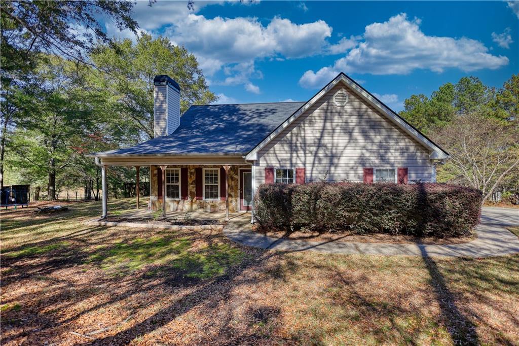 55 Ashland Farm Road Oxford, GA 30054 - Photo 52 of 55 a front view of a house with a yard