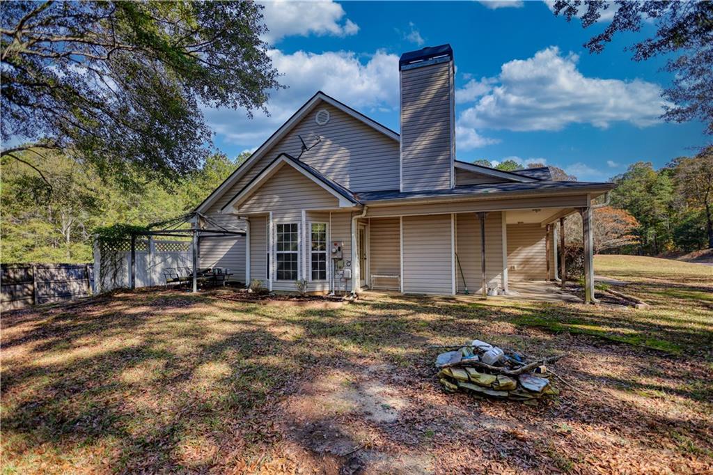 55 Ashland Farm Road Oxford, GA 30054 - Photo 55 of 55 a front view of a house with a yard