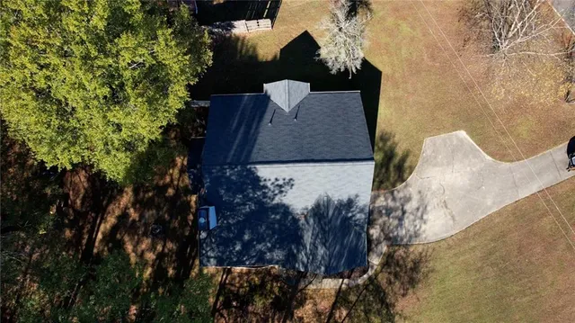 an aerial view of a house with swimming pool