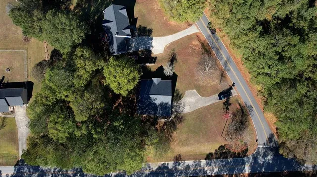 an aerial view of residential house with outdoor space