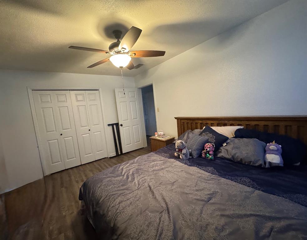 817 South Bell Street Hamilton, TX 76531 - Photo 19 of 28 a bedroom with a bed and window