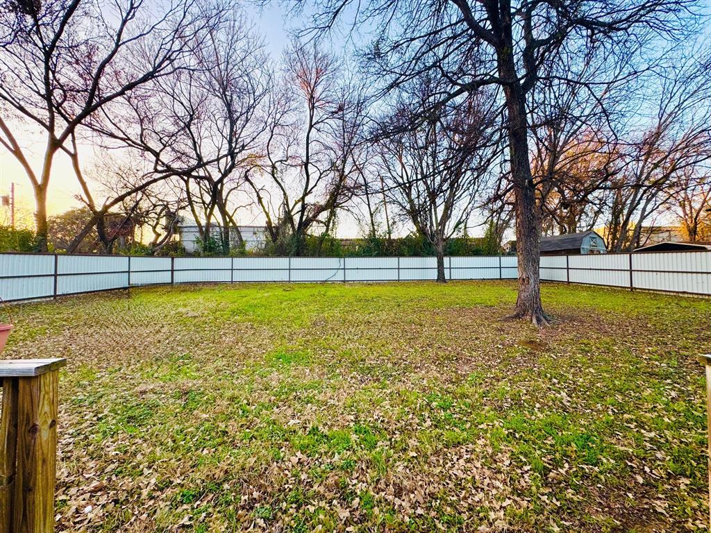 817 South Bell Street Hamilton, TX 76531 - Photo 26 of 28 a view of yard with swimming pool and tree