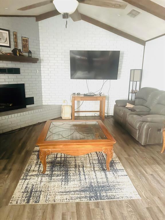 817 South Bell Street Hamilton, TX 76531 - Photo 5 of 28 a living room with furniture and a flat screen tv