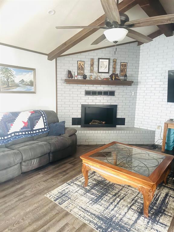 817 South Bell Street Hamilton, TX 76531 - Photo 6 of 28 a living room with furniture and a fireplace