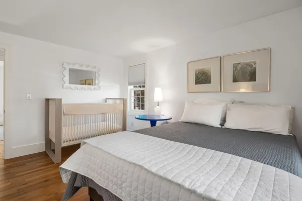 a bedroom with a bed and a table