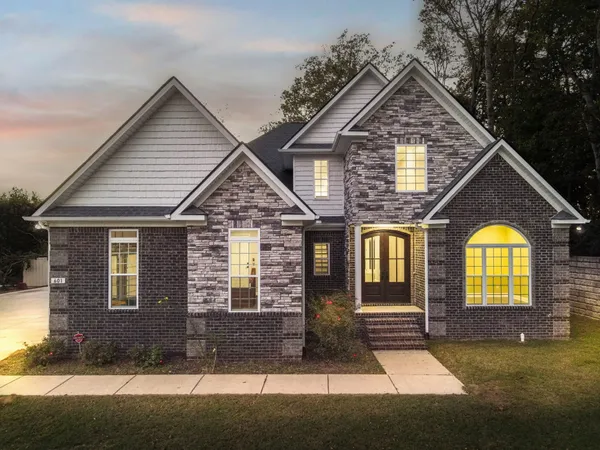front view of a house with a yard