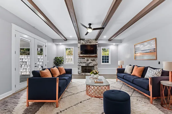 a large kitchen with stainless steel appliances kitchen island granite countertop a sink and cabinets