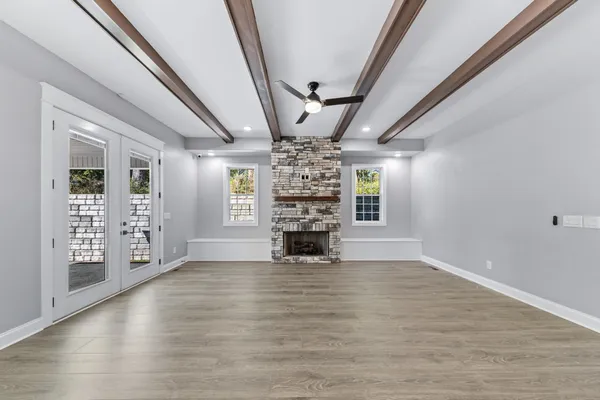 a kitchen with kitchen island a counter space a sink appliances and cabinets