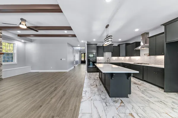 a view of an empty room with glass door and balcony