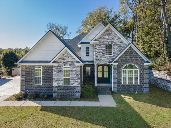 front view of a house with a yard