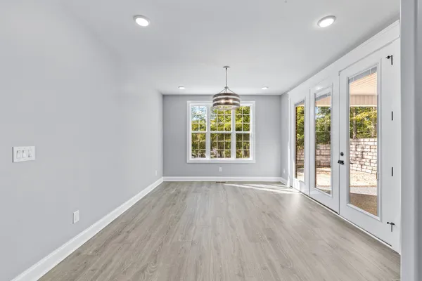 a bathroom with a double vanity sink and mirror with shower