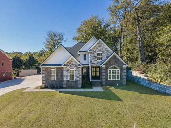 a view of a hallway view with wooden floor and staircase