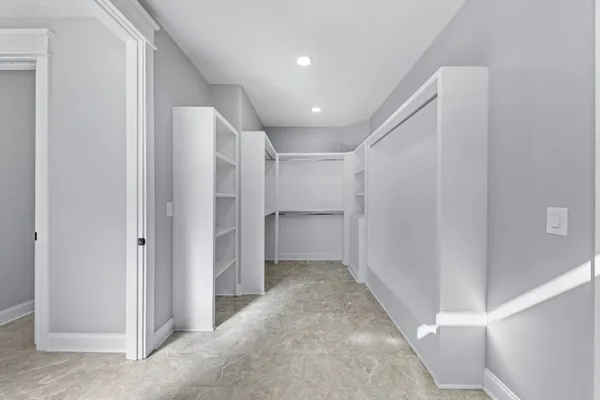 a view of an empty walk in closet