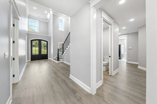 a view of an empty room with window and fireplace