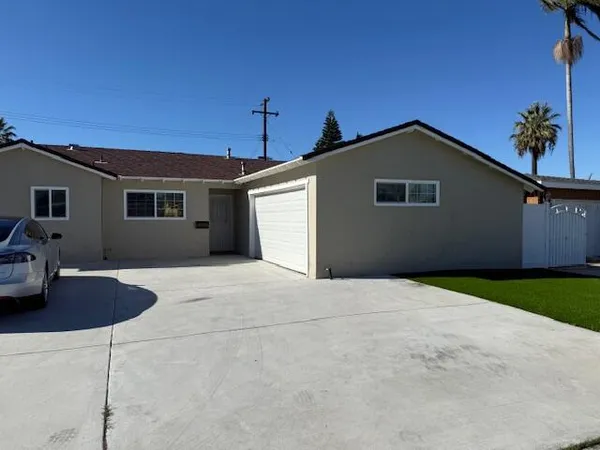 a front view of a house with yard