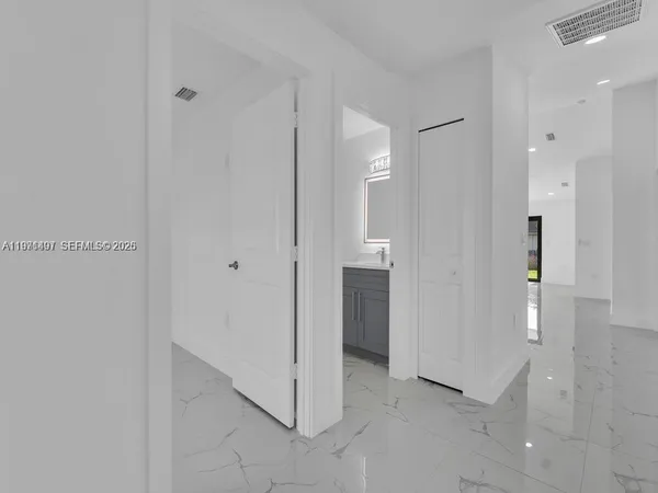 a kitchen with stainless steel appliances a refrigerator and a sink