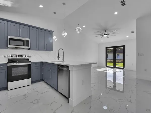 a kitchen with a sink and cabinets