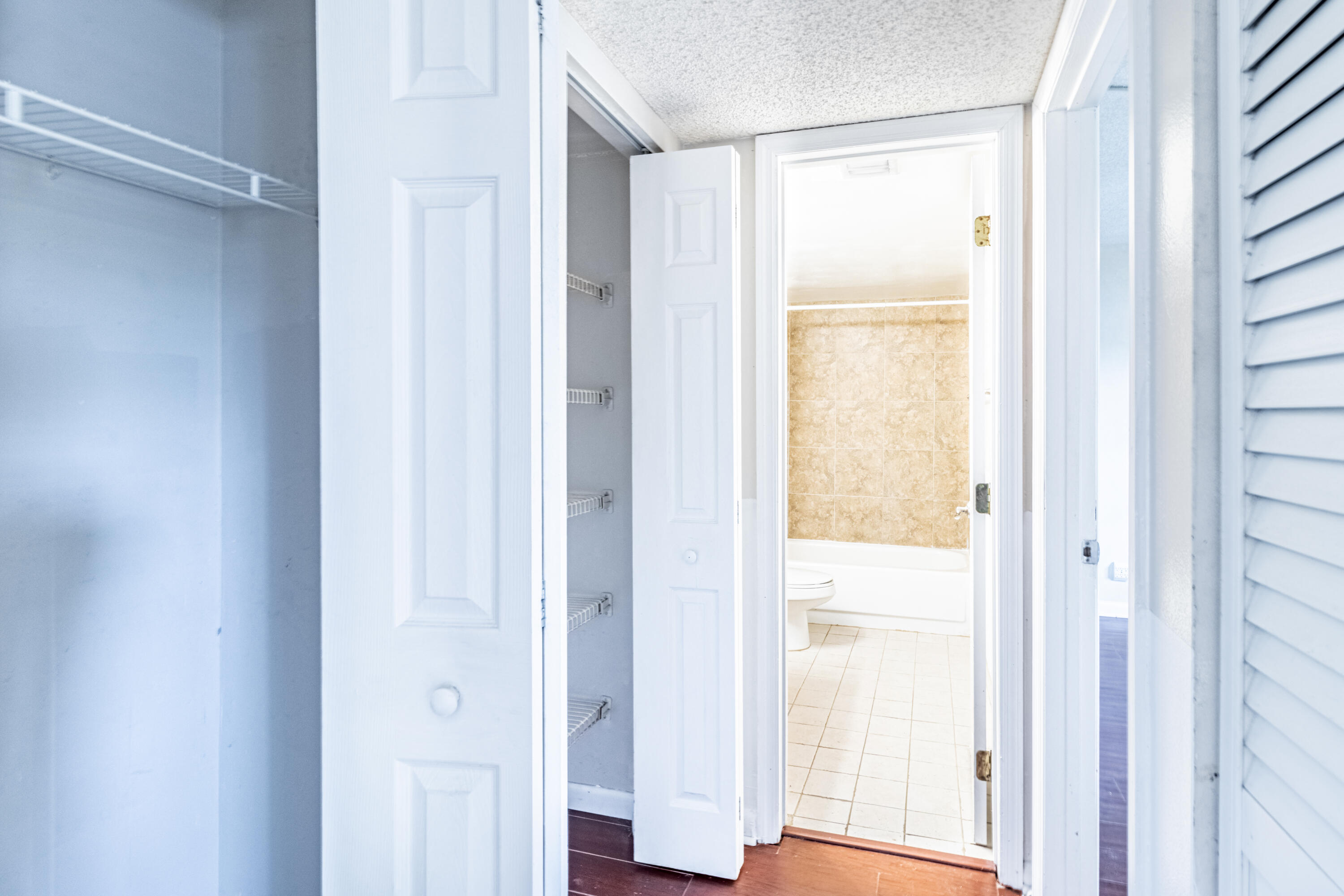 3905 North Nob Hill Road, Unit 103 Sunrise, FL 33351 - Photo 19 of 27 Hallway to guest bathroom