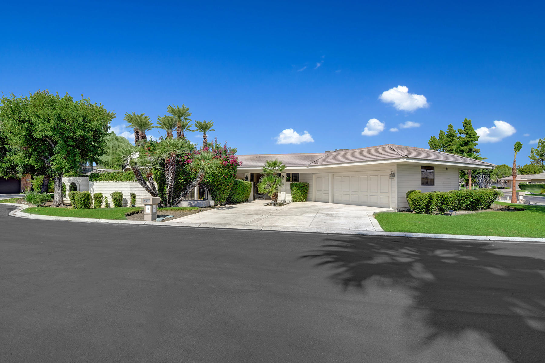 6 Eaton Rancho Mirage, CA 92270 - Photo 36 of 36 a front view of a house with a yard and a garage