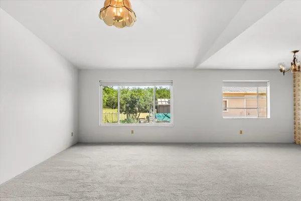 a kitchen with granite countertop cabinets stove top oven and refrigerator