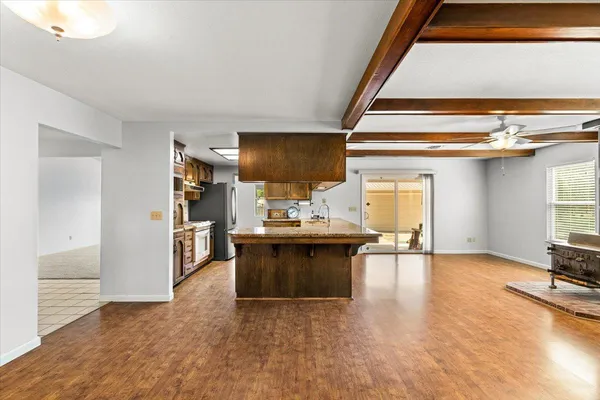 a view of an empty room with a ceiling fan