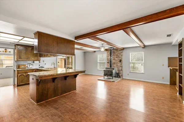 a bathroom with a sink toilet tub and shower