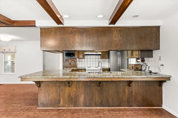 a view of a parked car in front of house