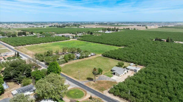 a view of a field with an ocean