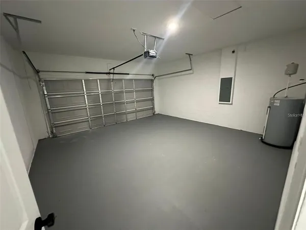 a kitchen that has a dining table and chairs