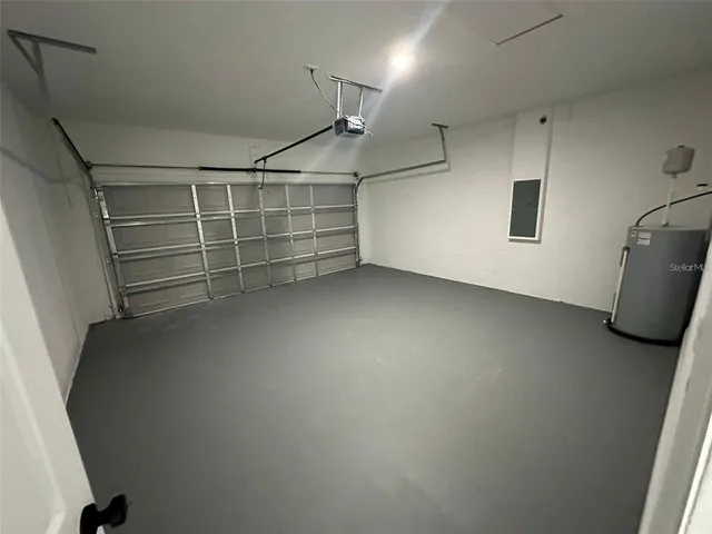 a kitchen that has a dining table and chairs