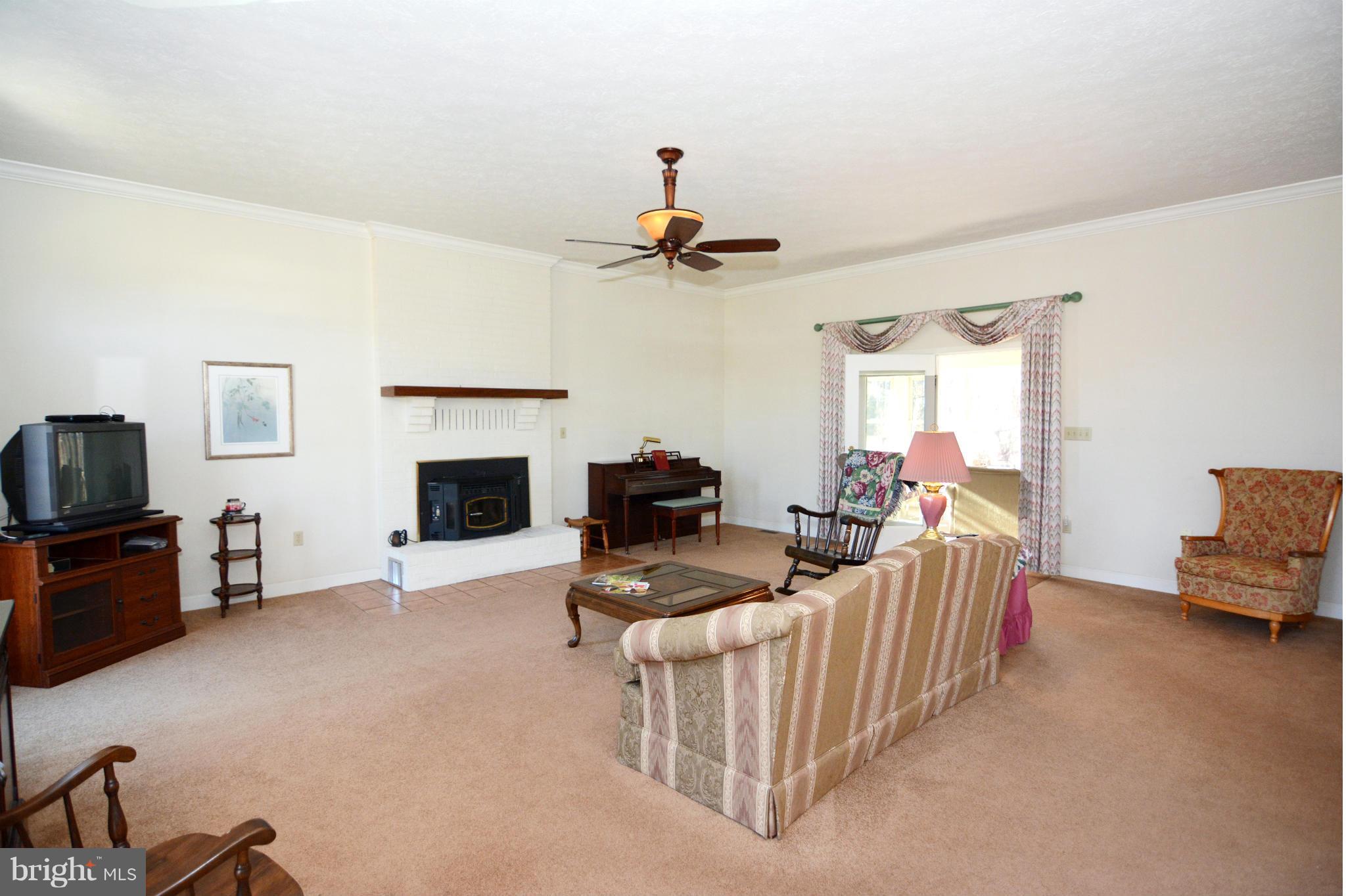 3 Poplar Point Road Edgewater, MD 21037 - Photo 14 of 30 Family / Living Room with Pellet Stove Ambiance